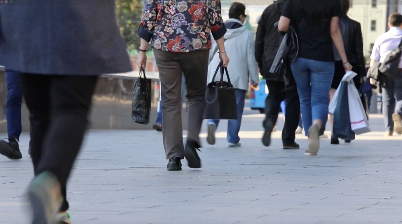 People walking together down a city street